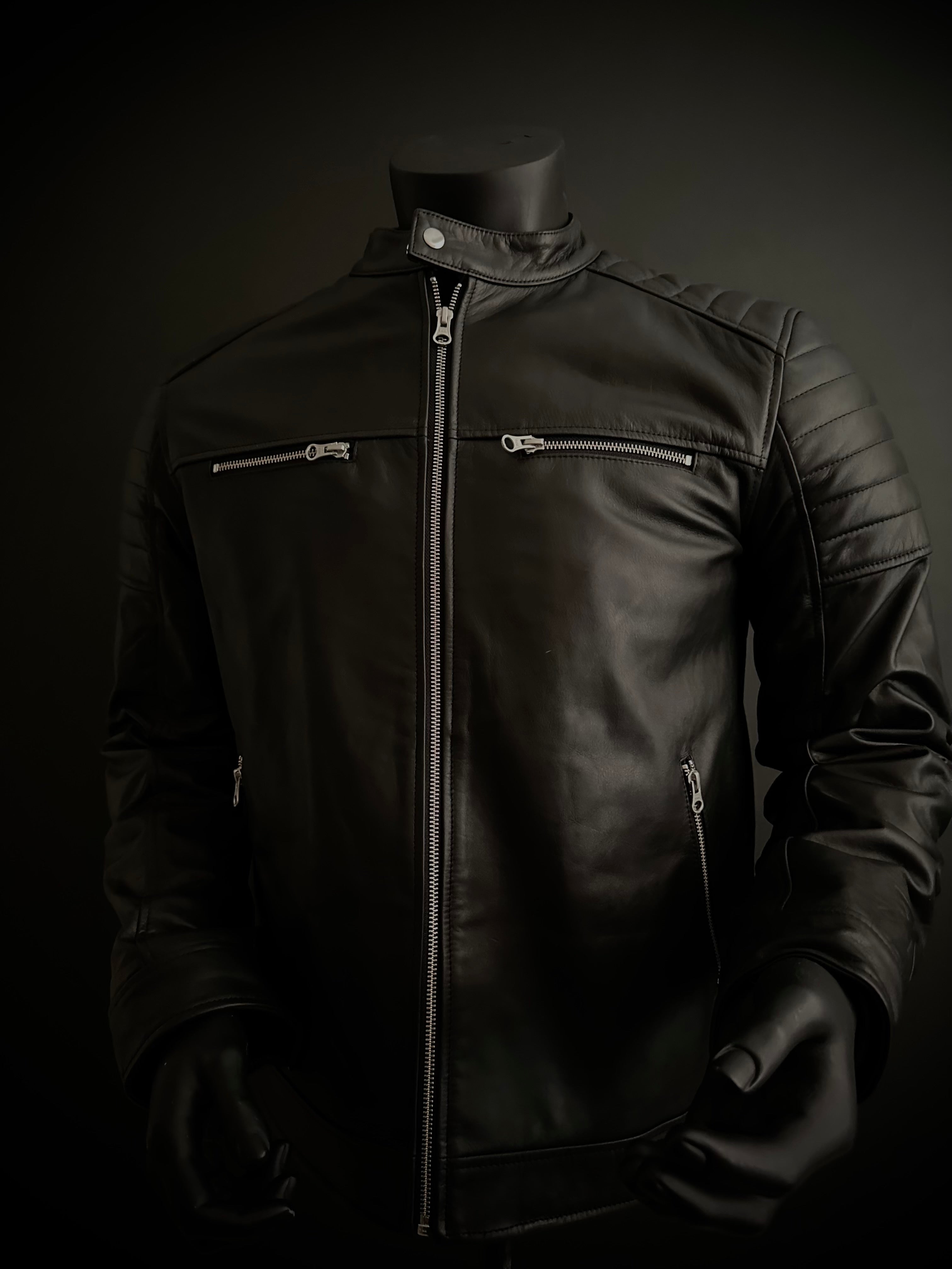 Front of cafe racer style black motorcycle jacket with shoulder padding and zipper design