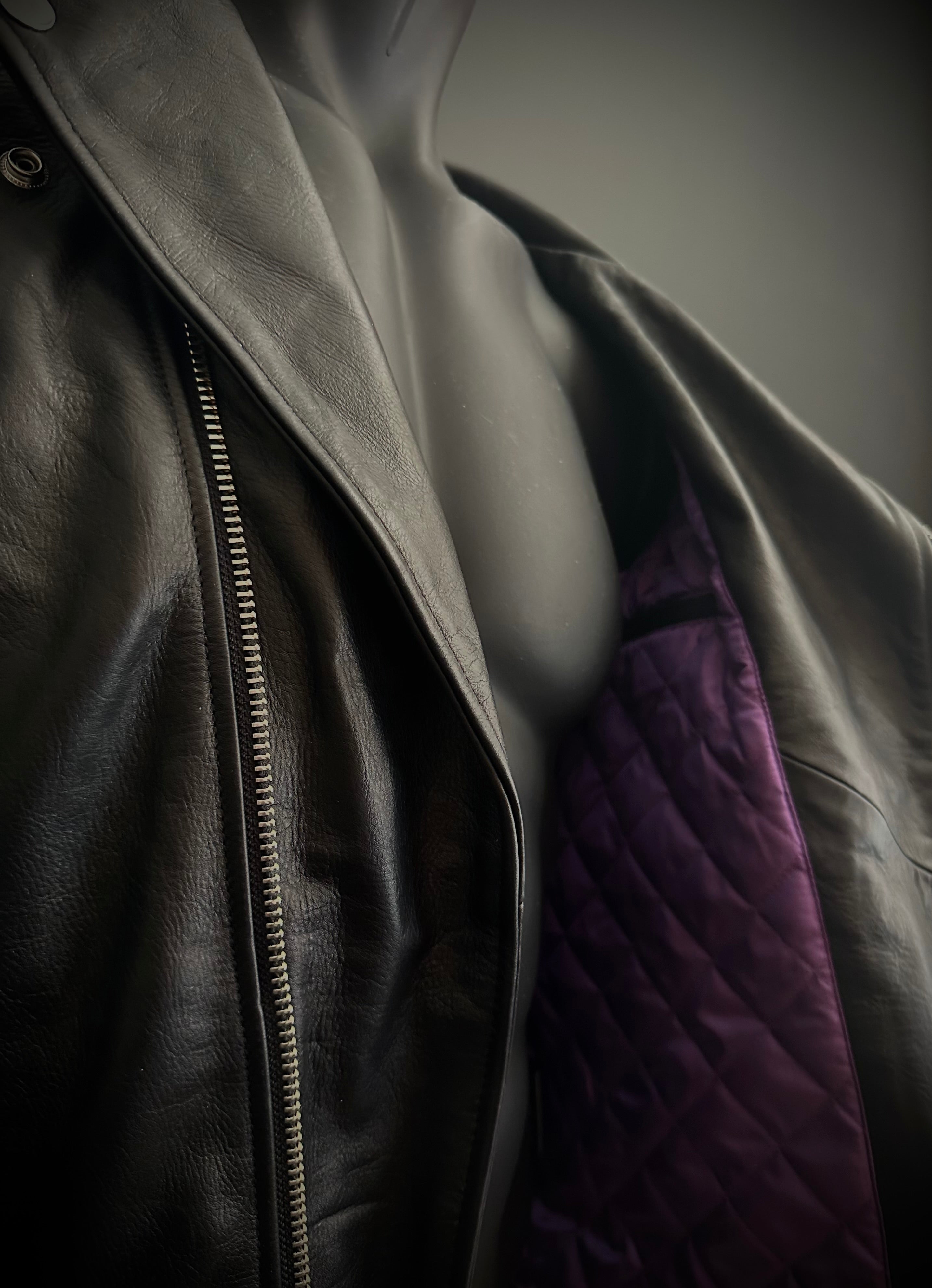 Dark purple inner stitched lining of black leather jacket